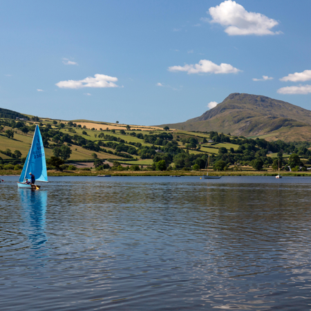 Dinghy sailing near idyllic waters