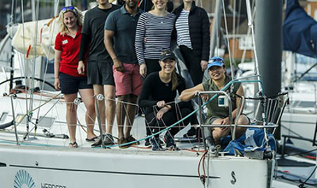 People stood crowded on a yacht