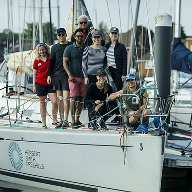 People stood crowded on a yacht