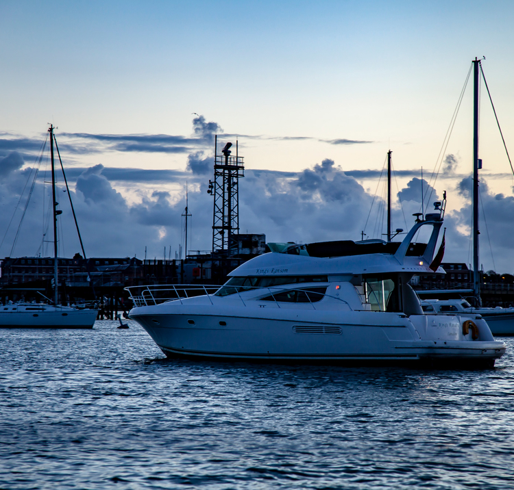 Powerboat sailing at dusk