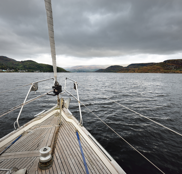 Mid shot of boats bow as it sails through the water