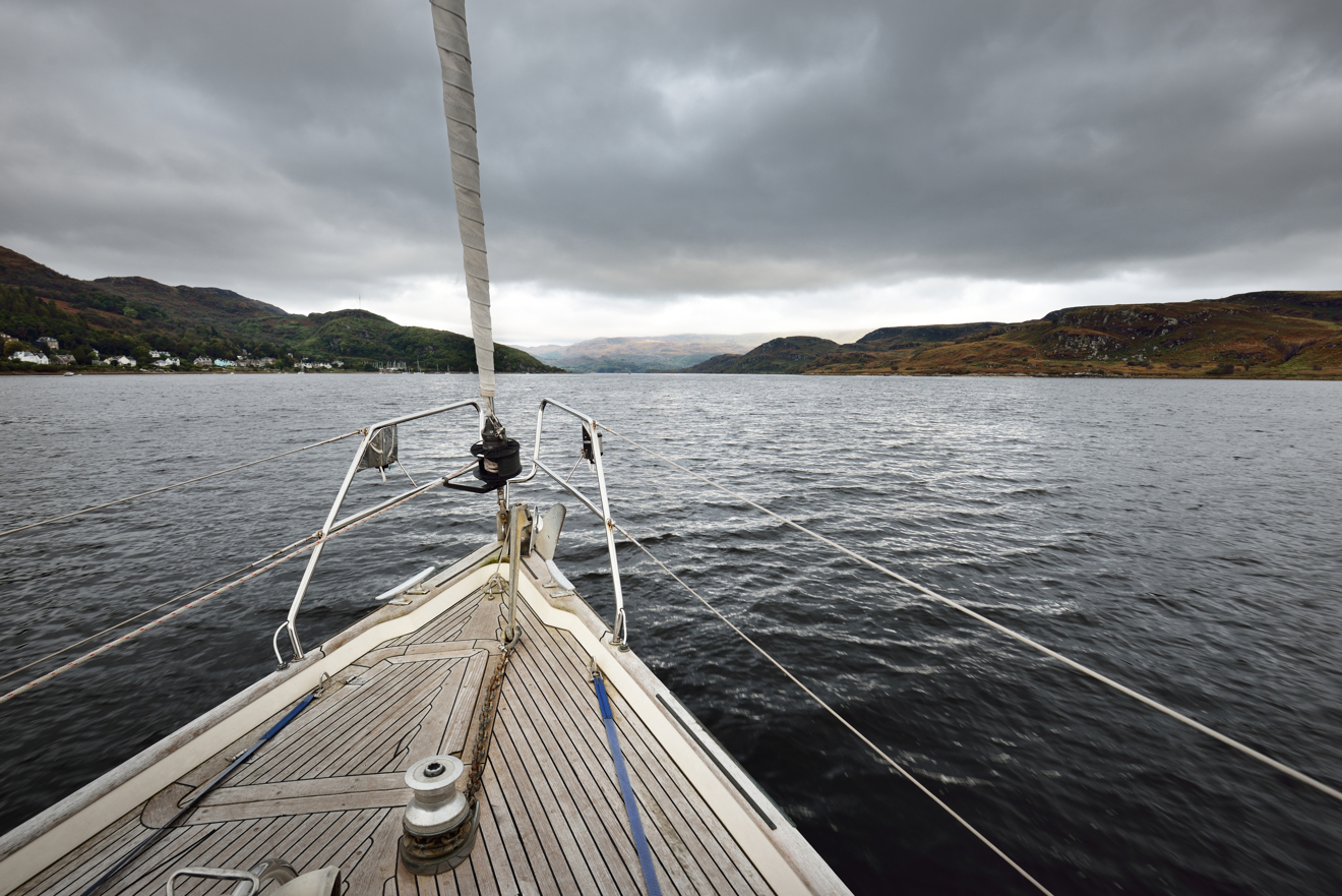 Mid shot of boats bow as it sails through the water
