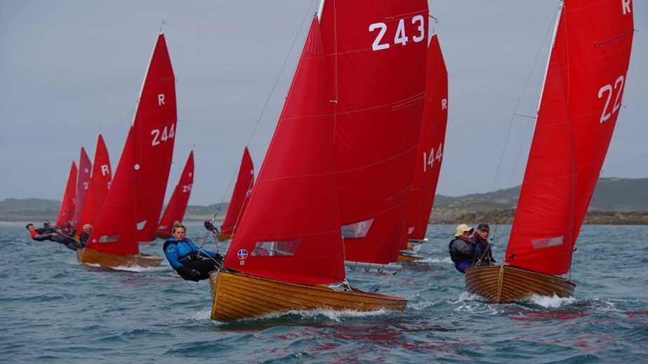 A group of boats part of the Redwing national class