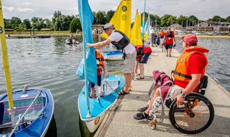 sailability sailing session, sailor in wheelchair approaching boat