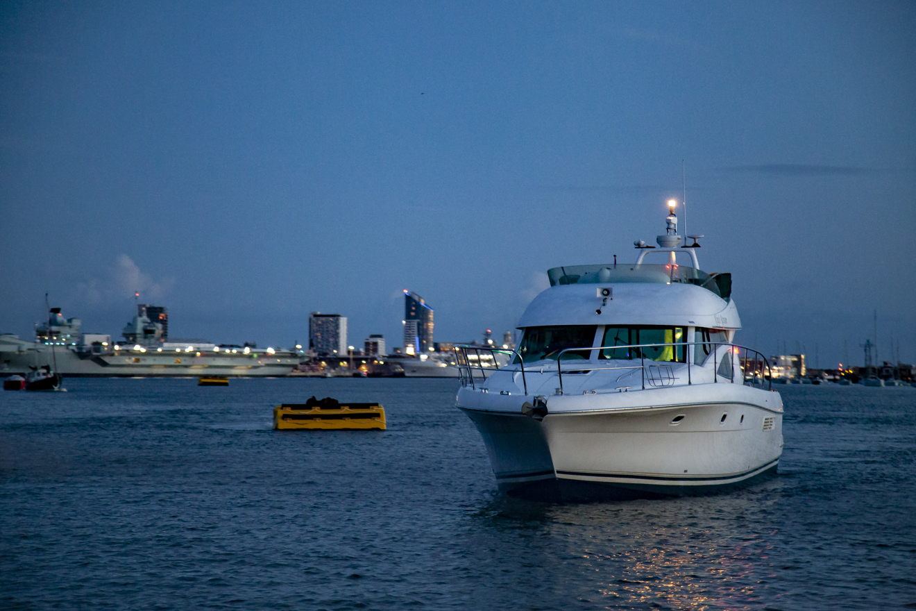 powerboat sailing at night time