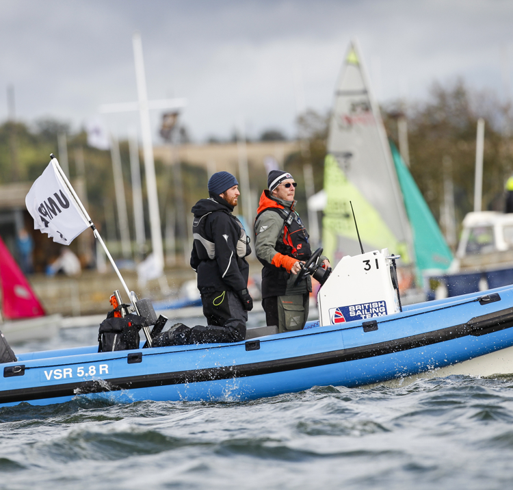 two race officials on a powerboat