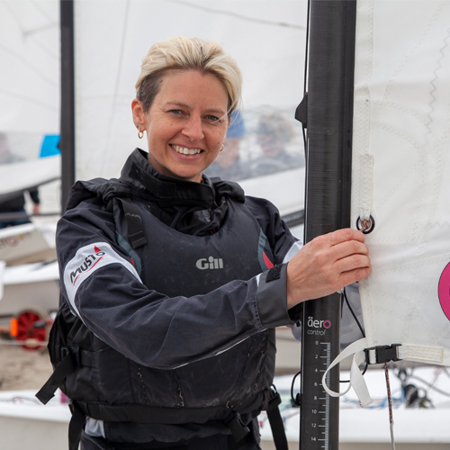 sailor smiling and adjusting sails