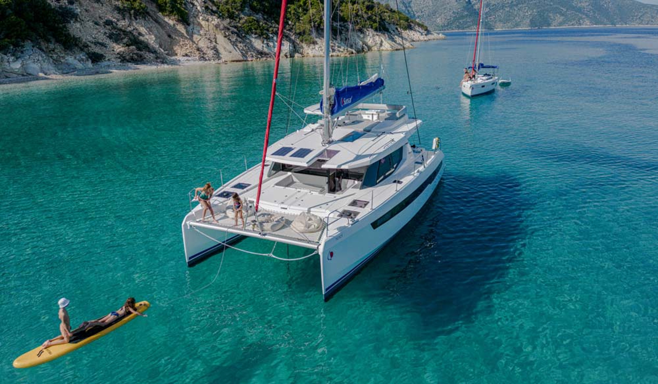 Sunsail catamaran and monohull at anchor