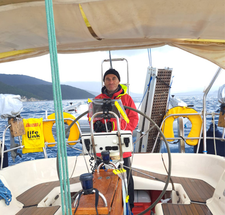 Mark stood on his boat