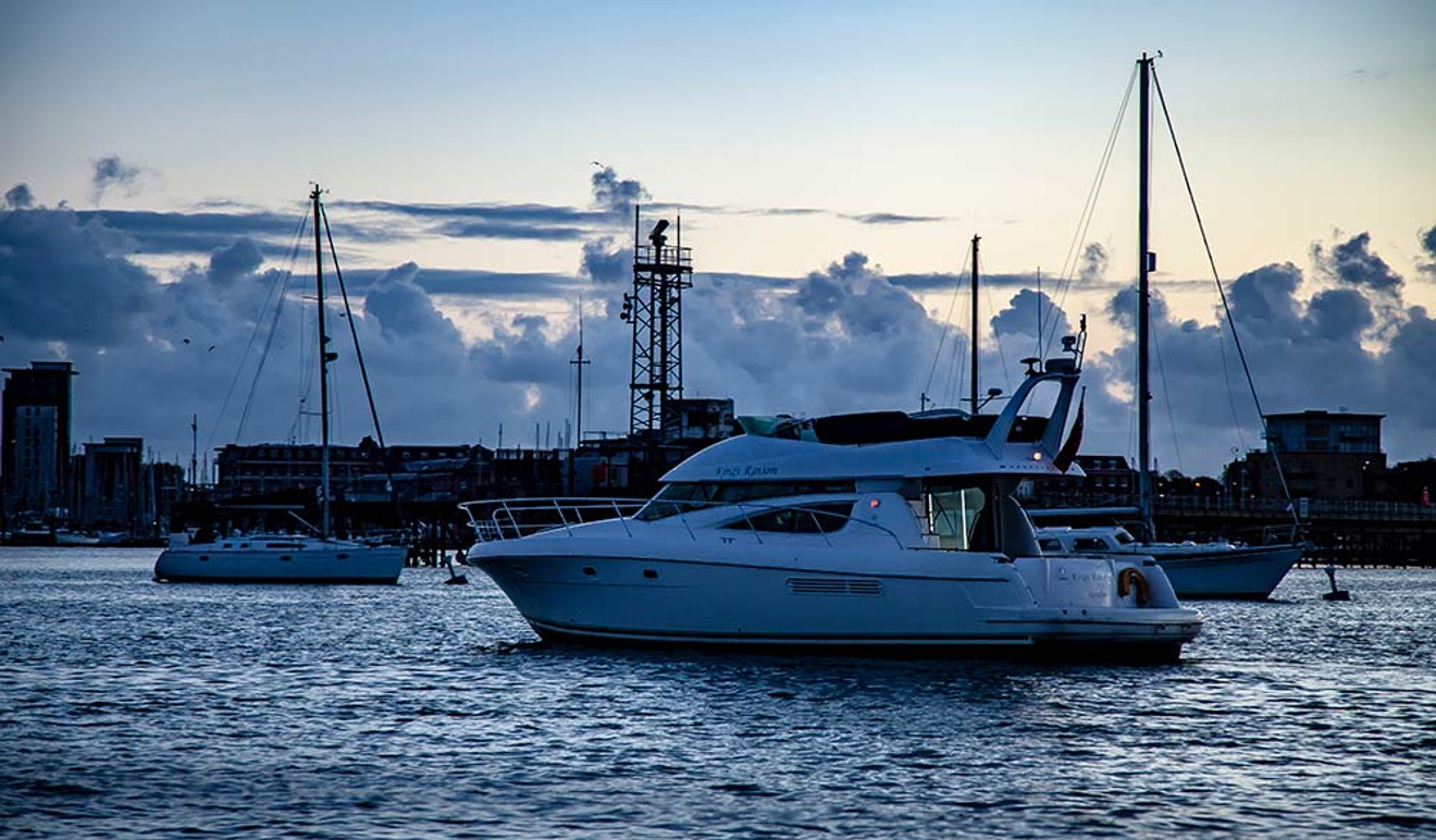 powerboat sailing at night