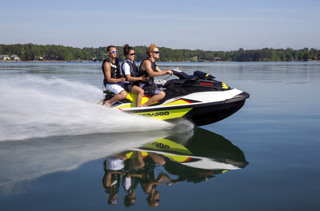 Three people sat on a jetski