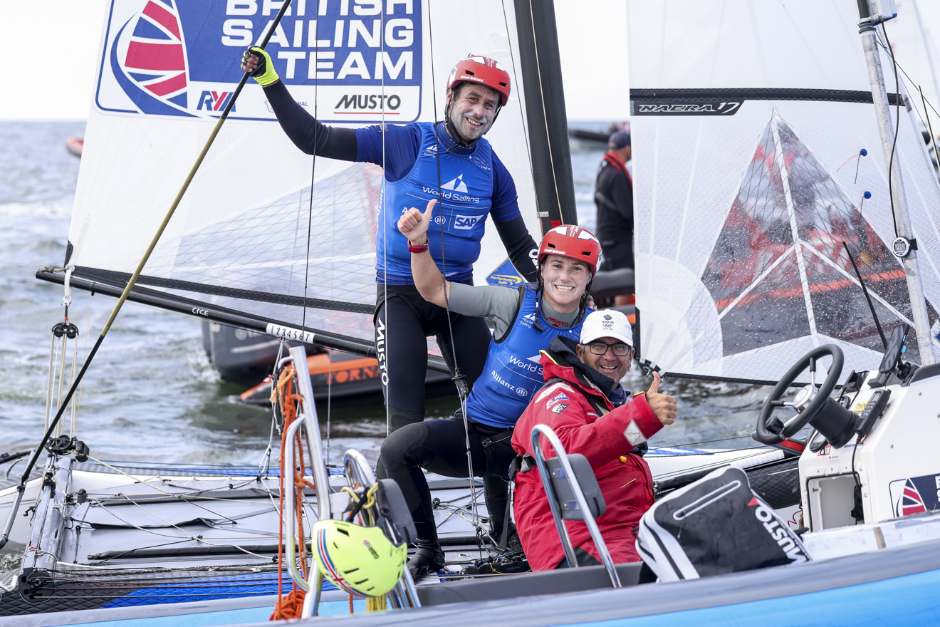 Britain's Kite girls sailing world championships where three men are sailing on a boat