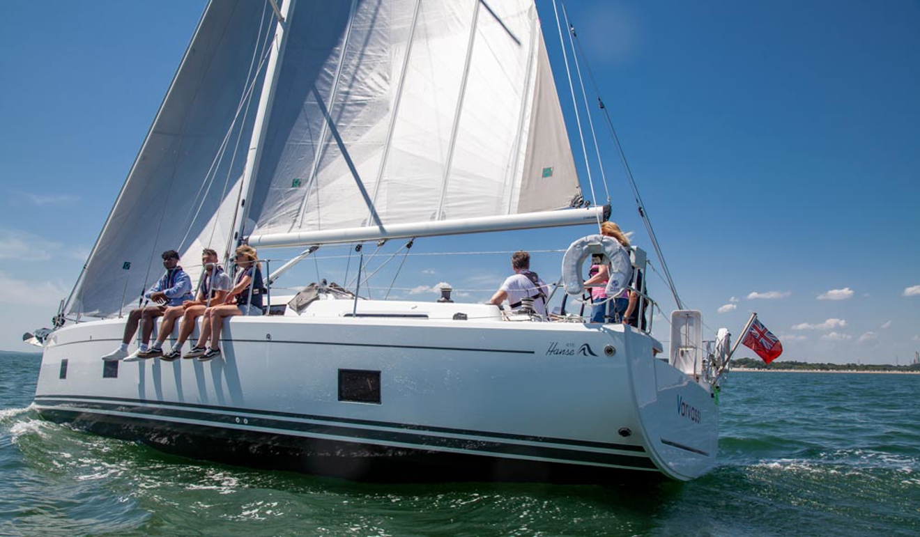 Yacht sailing through sunny waters
