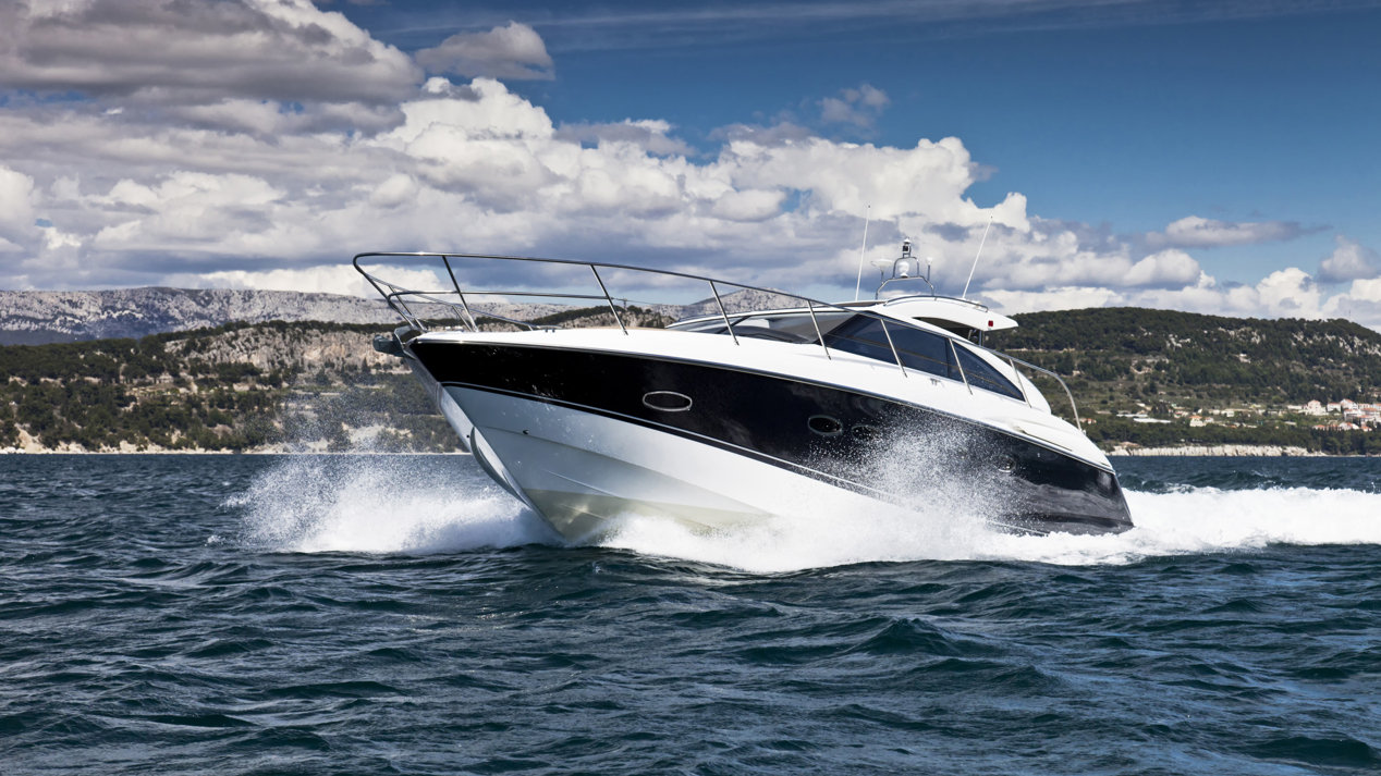 Motor cruiser speeding through the ocean