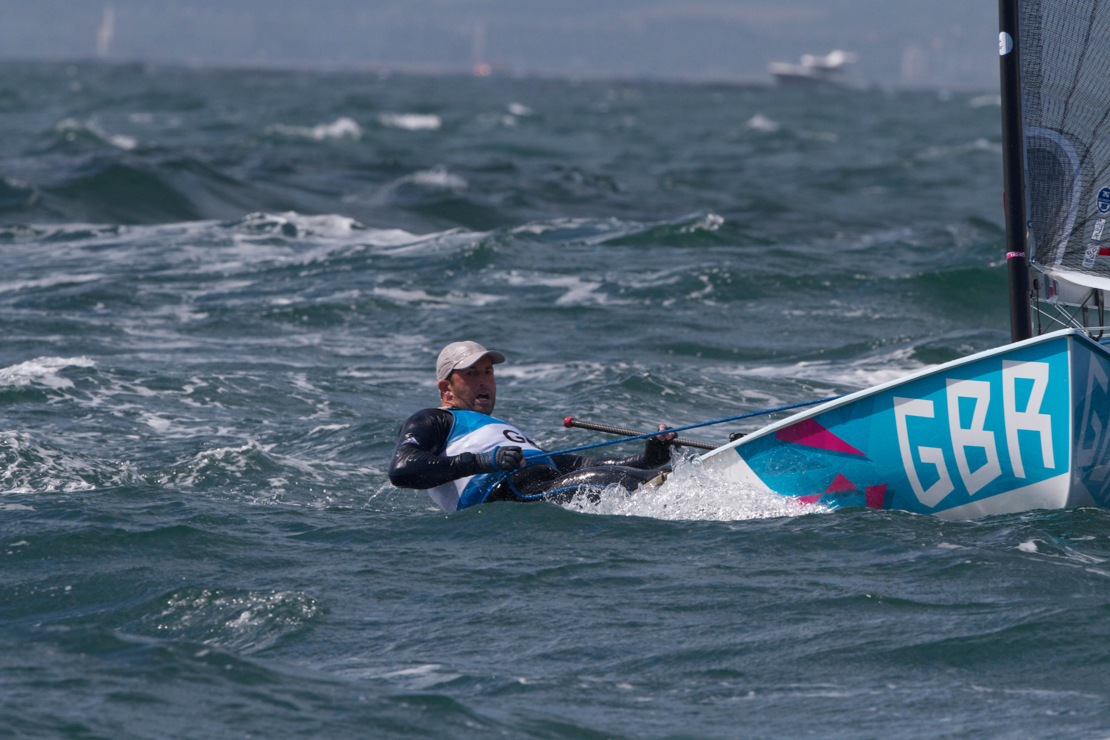 Dinghy sailor travelling through the water