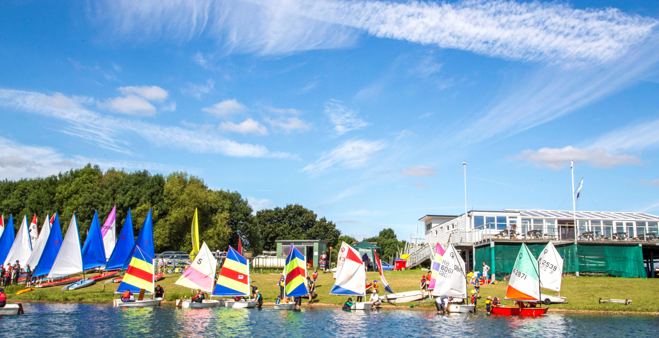 Optimists On Shoreline With Club Test