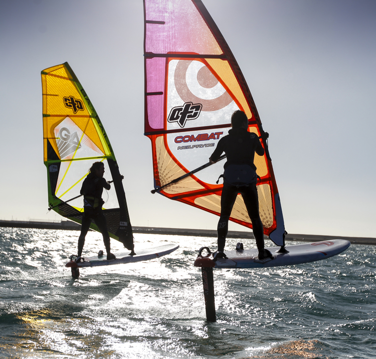 Two people wing surfing