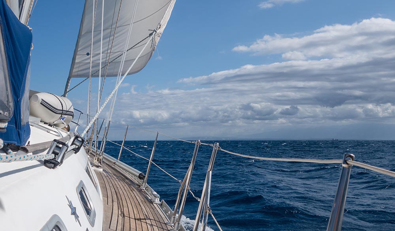 close up of side of the yacht sailing in the ocean