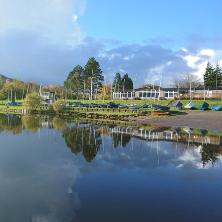wide shot of award winning sailing club next to water