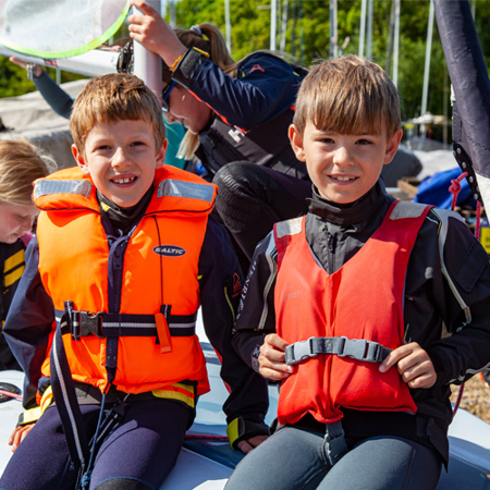 young sailors wearing life jackets
